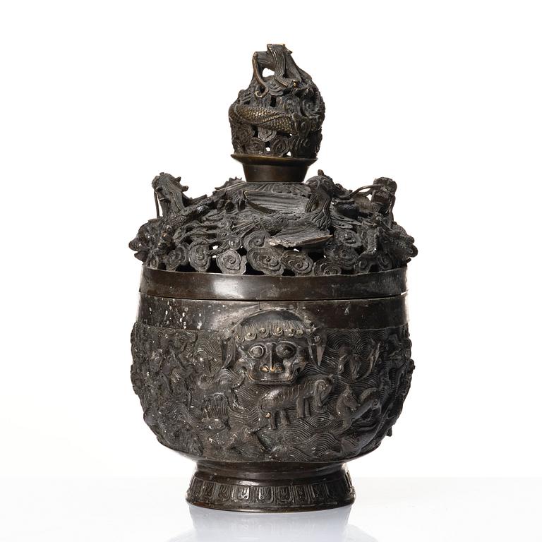 A bronze reticulated incense burner with cover, Qing dynasty (1644-1912).