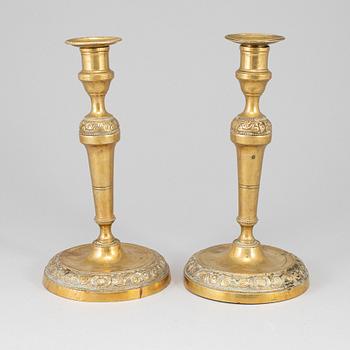 A pair of bronze candlesticks, first half of the 19th century.