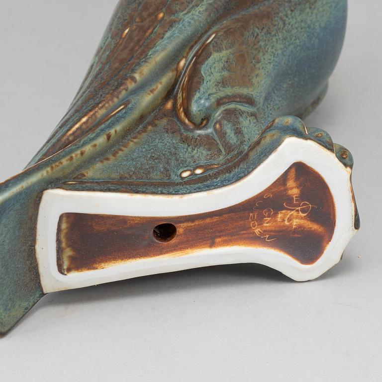 GUNNAR NYLUND, a stoneware sculpture of a falcon, Rörstrand mid 20th century.