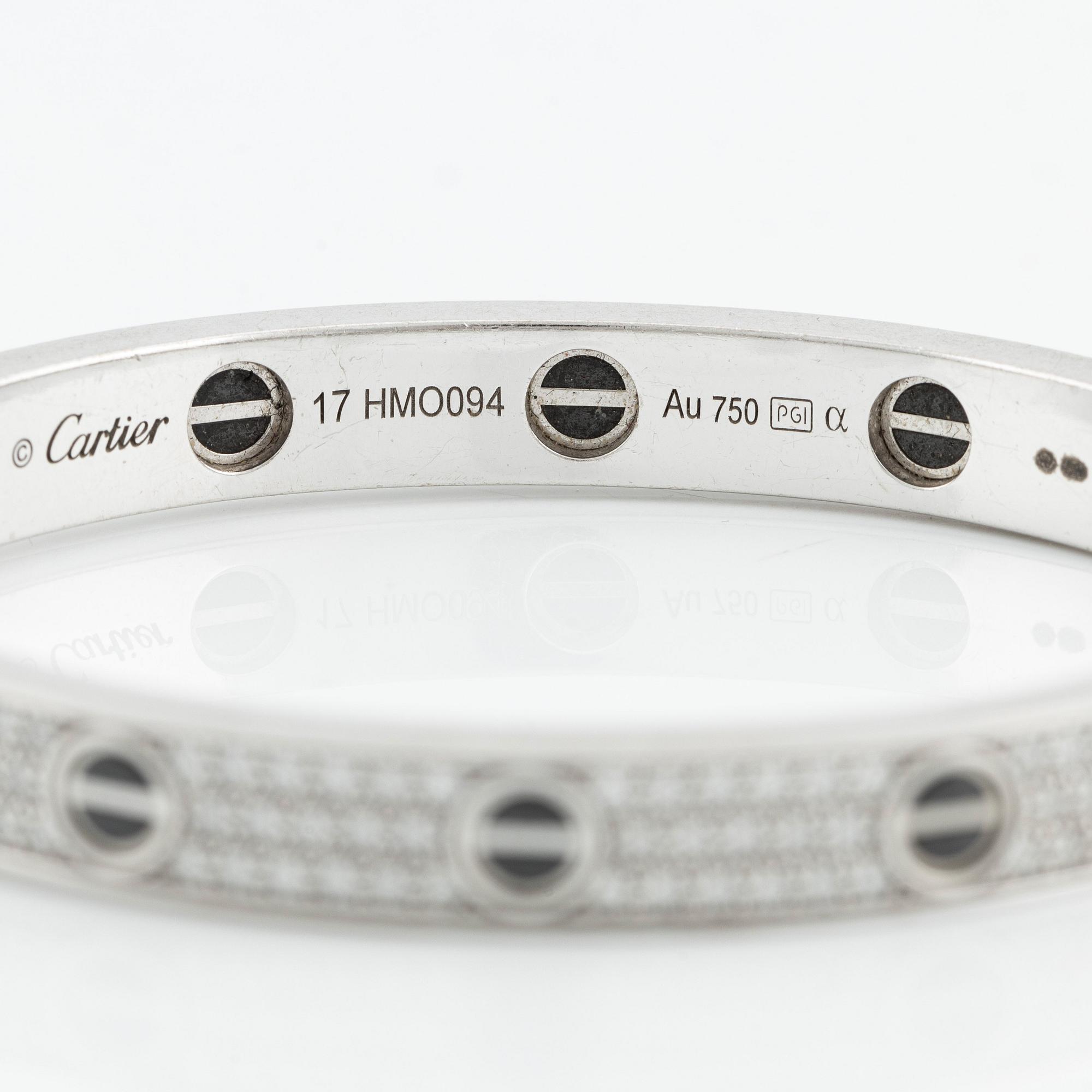 An 18K white gold Cartier bracelet "Love" with round brilliant-cut diamonds and ceramic.