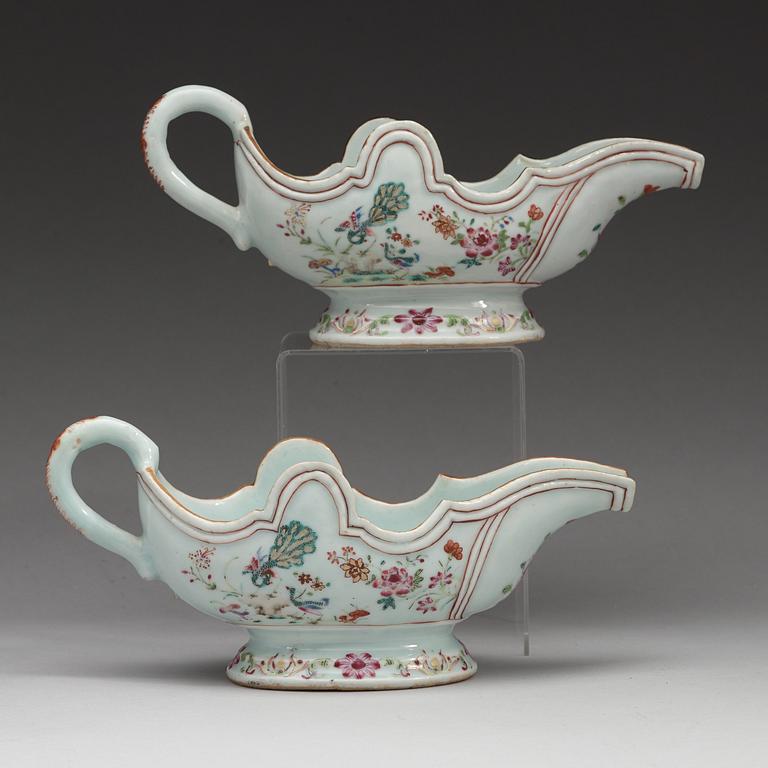 A pair of famille rose 'double peacock' sauce boats, Qing dynasty, Qianlong (1736-95).