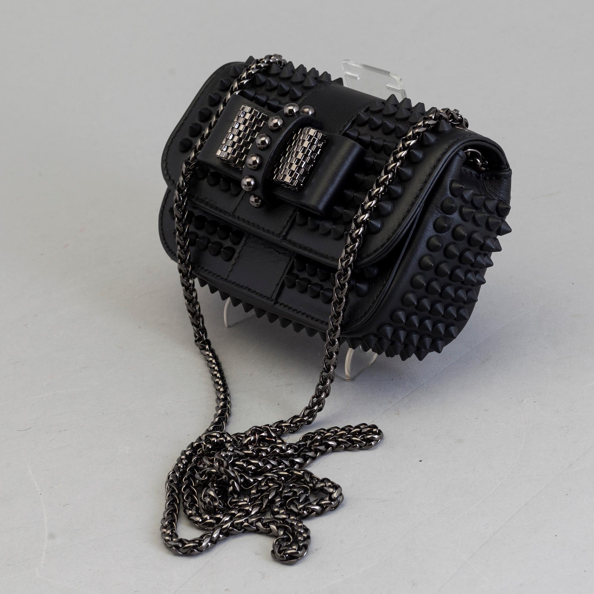 An eveningbag with studs by Christian Louboutin.