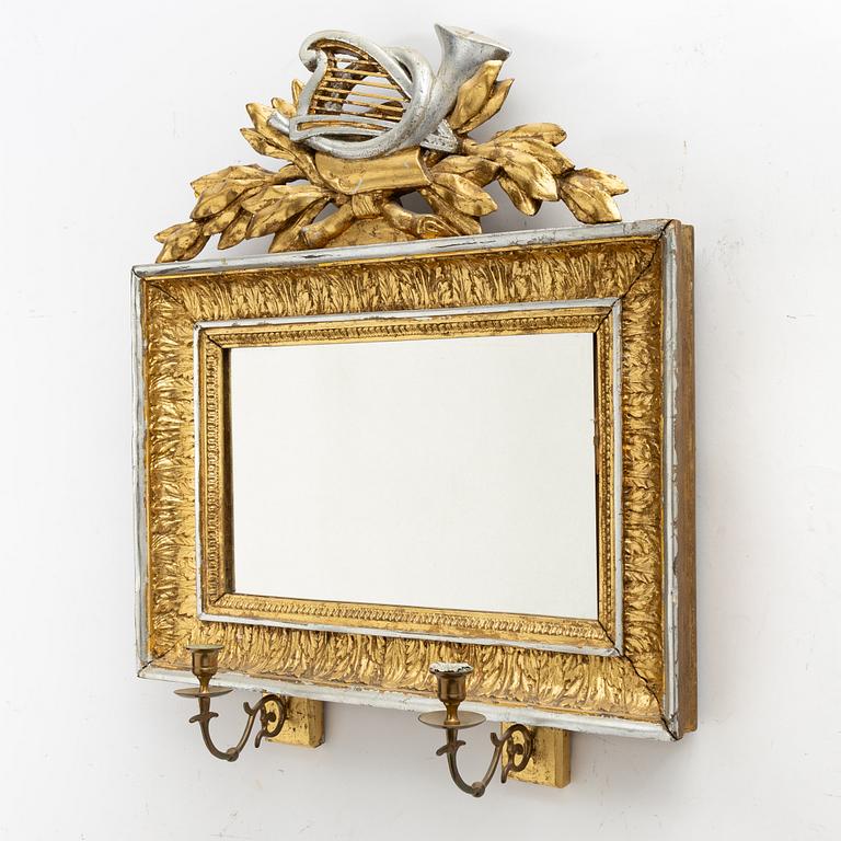A gilt-gesso two-branch Empire girandole mirror, first part 19th century.