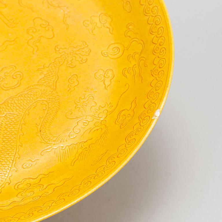 A Chinese yellow-glazed dish, 20th century.