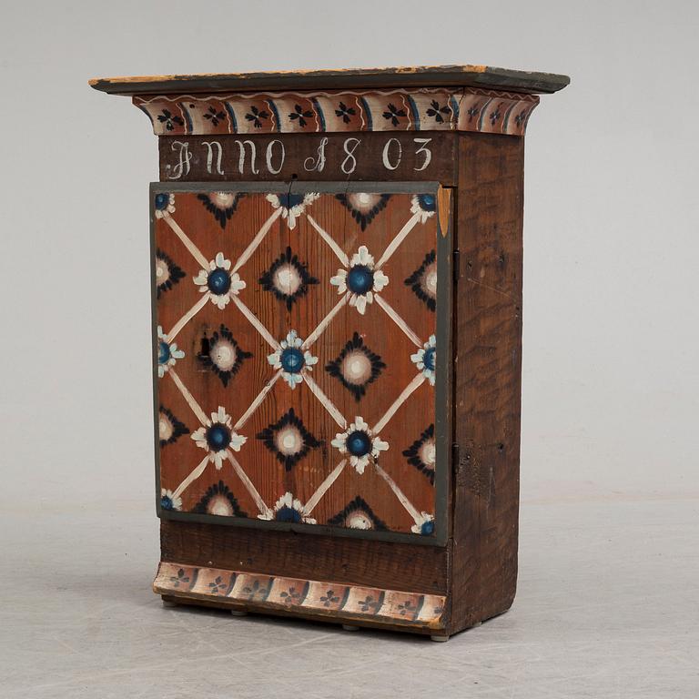 An early 19th century wall cabinet.