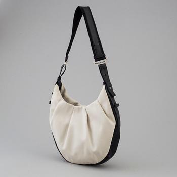 A vwite and black monogram hobobag by Yves Saint Laurent.