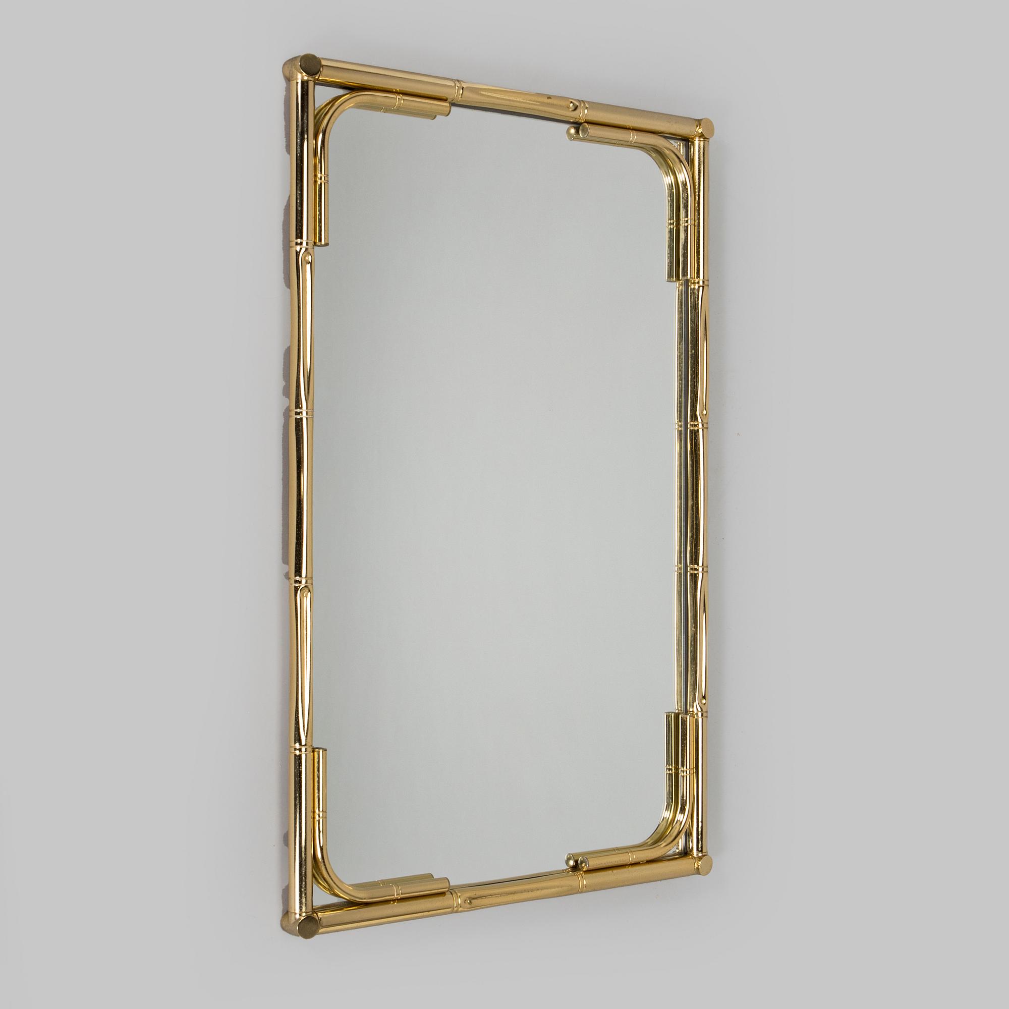 A 1970s/80s brass mirror.