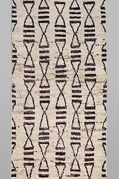 A runner carpet, Morocco, c. 374 x 80 cm.
