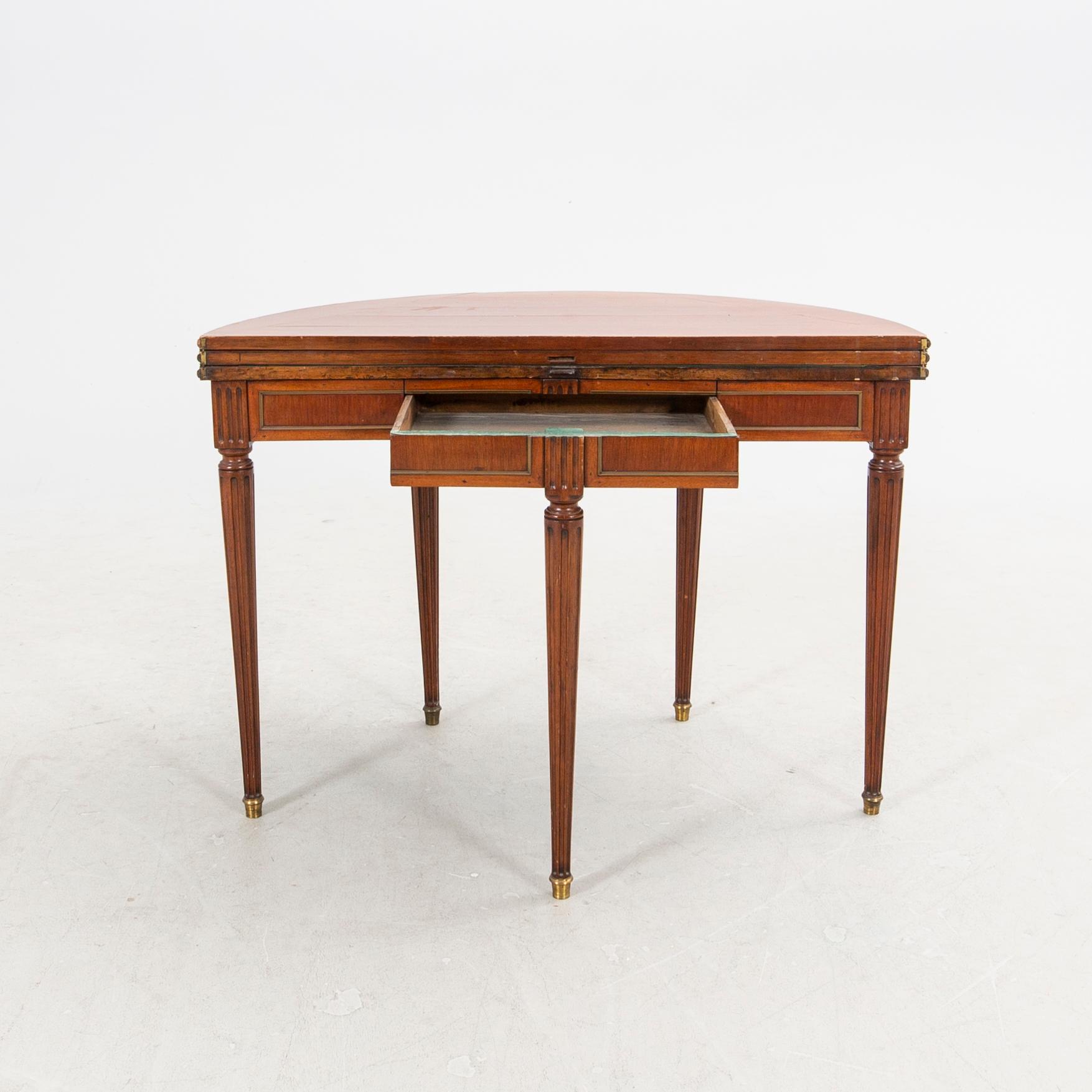 An erarly 1800s mahogany game table.