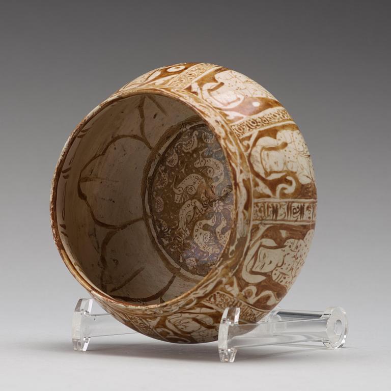 A BOWL, pottery with luster decor, height ca 10,5 cm, Persia/Iran 12th-13th century.