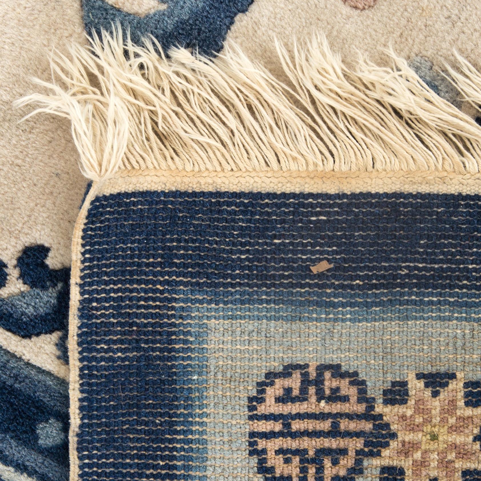 An old Chinese carpet ca 187 x 127 cm.