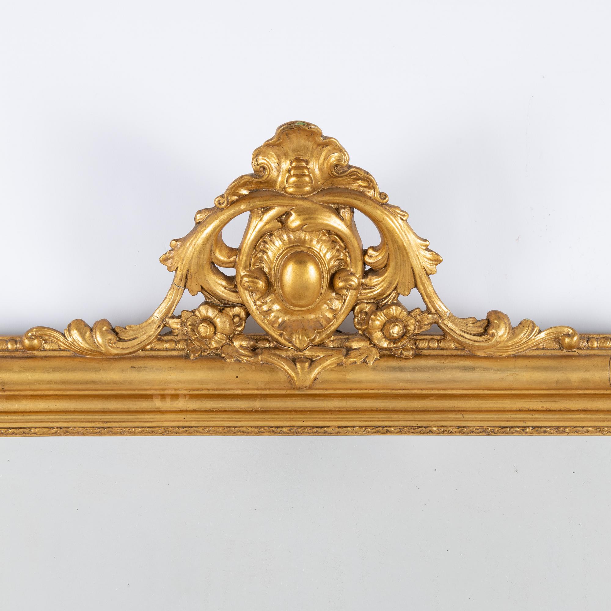 A gesso rococo-revival mirror, later part of the 20th Century.