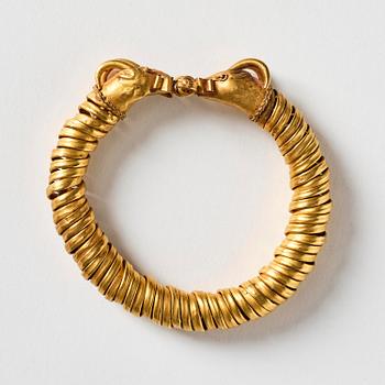 A Greco-Egyptian gold ram's head bracelet, Presumably Ptolemaic period ca 300 BC - 30 BC.