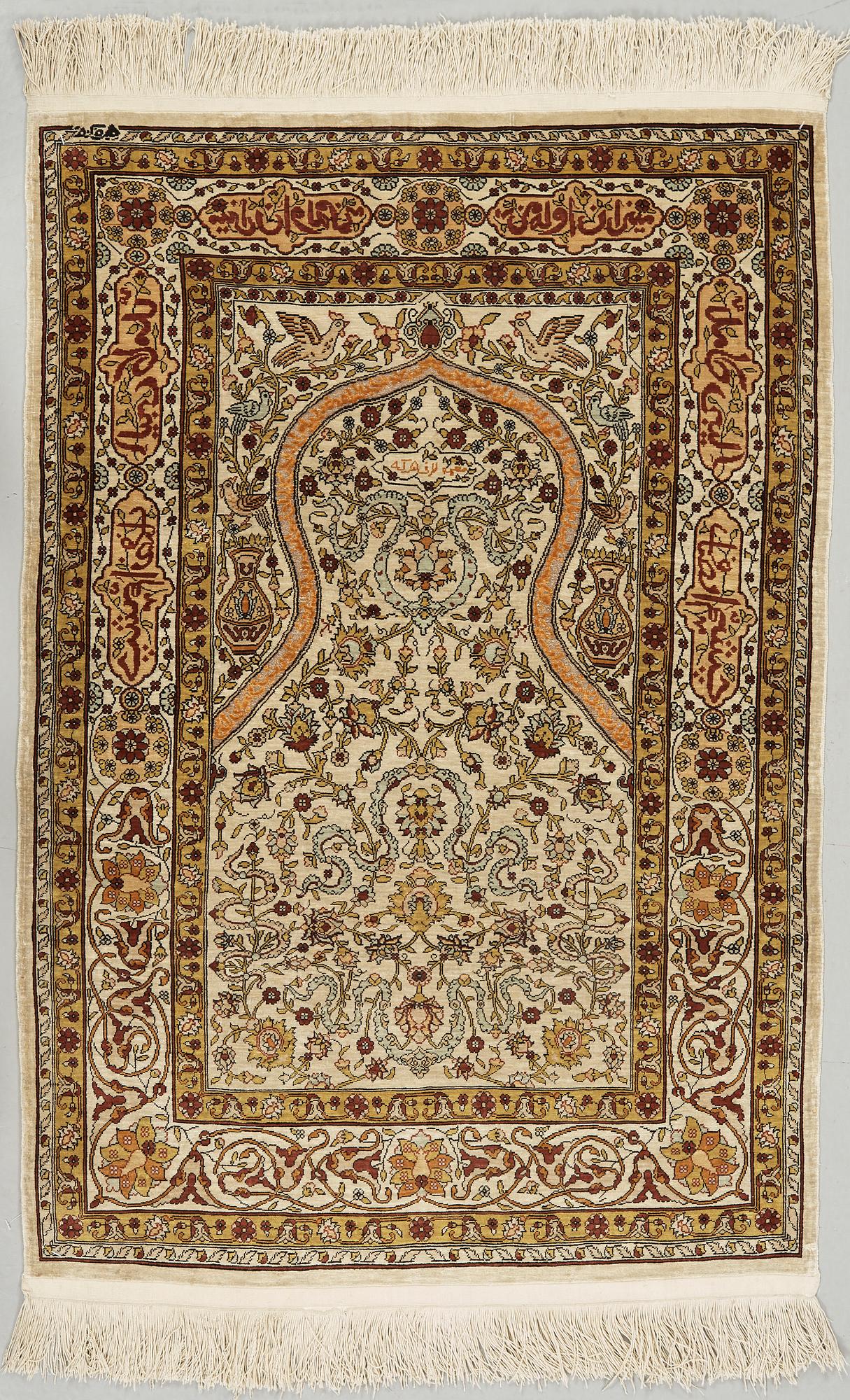 A silk Hereke possibly, around 96 x 66 cm.