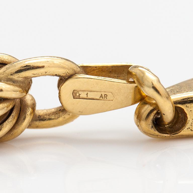 An 18K gold necklace. Unoaerre, Italy.