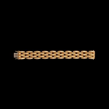 1201. A Cartier gold bracelet, c. 1990.