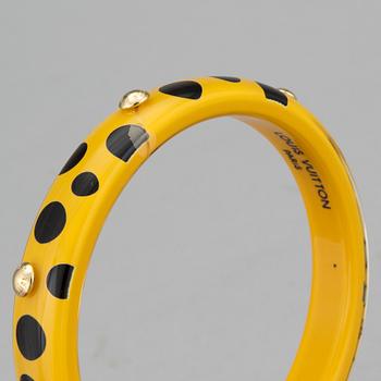 LOUIS VUITTON, Limited Edition Yayoi Kusama "Yellow Dots Infinity" Bangle PM Bracelet.