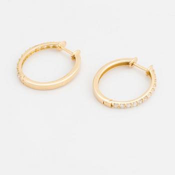 Brilliant cut diamond hoop earrings.
