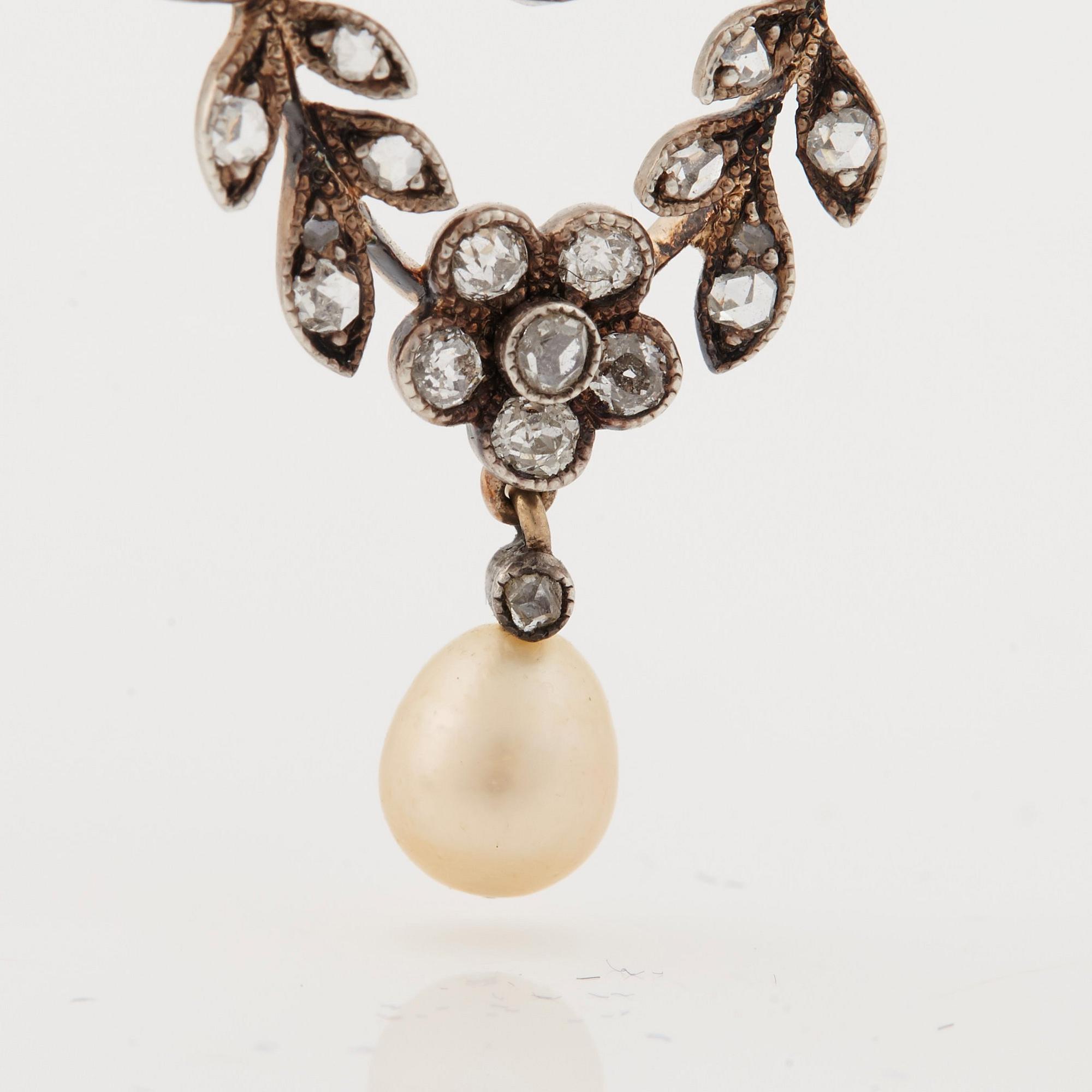A natural pearl, old-, rose-and briolette cut diamond pendant. Early 20th cent.