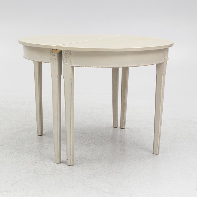 A Gustaivan style dining table/ two crescent shaped tables, end of the 19th century.