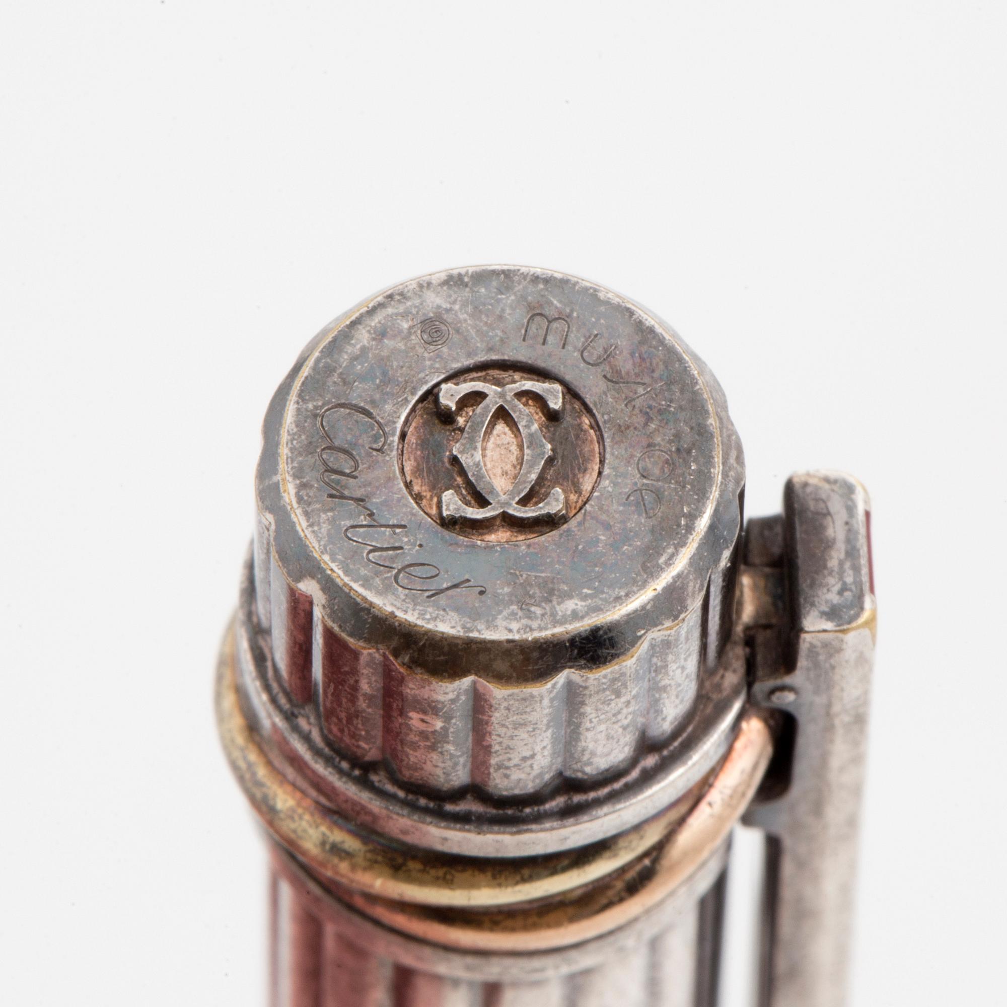 A Cartier lighter and pen.