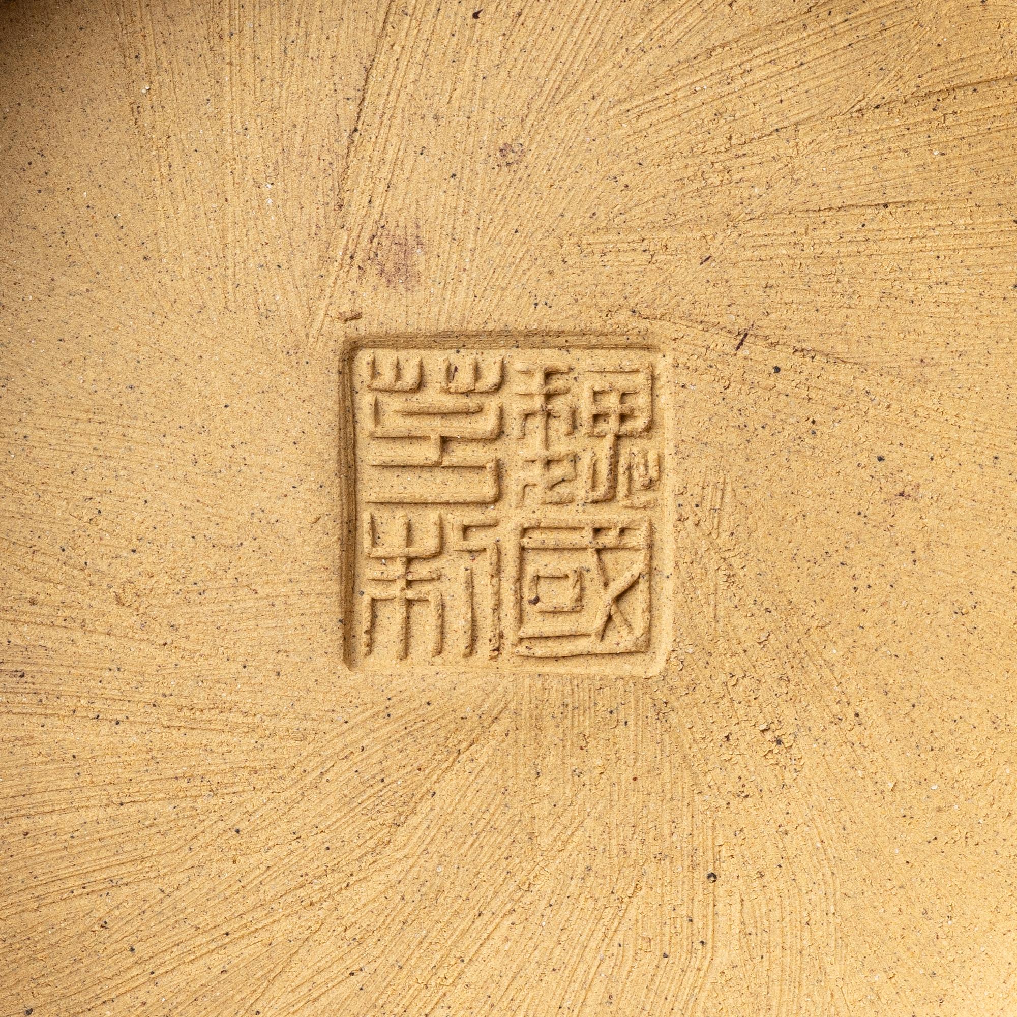 A group of three bright yellow yixing 'Gongfu' teapots, China, 1990s.