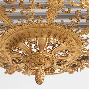 A rococo-revival gilt-brass sixteen-light chandelier, mid 19th century.