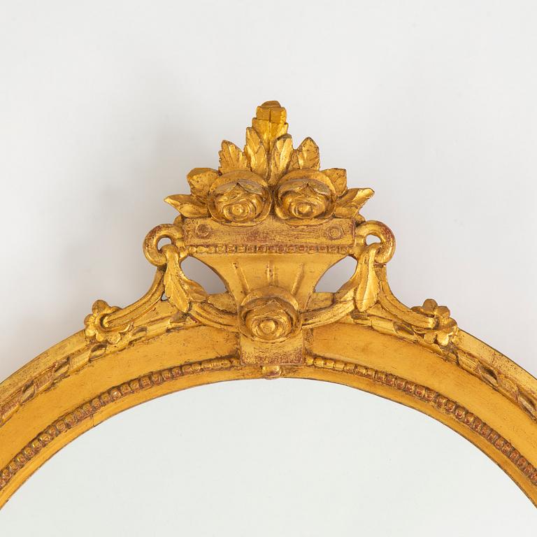 A Gustavian two-light girandole mirror, late 18th Century.