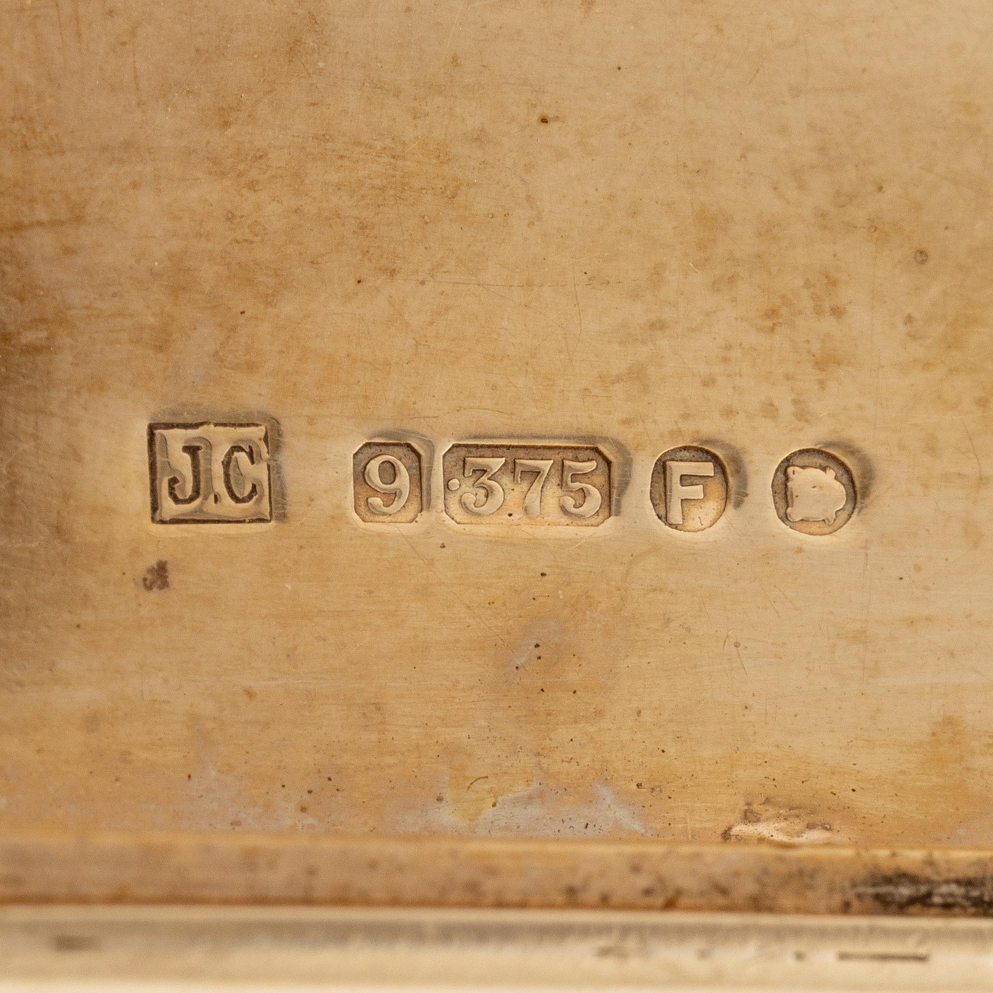 A Cartier 9 carat gold and calibré-cut sapphires cigarette case, London.