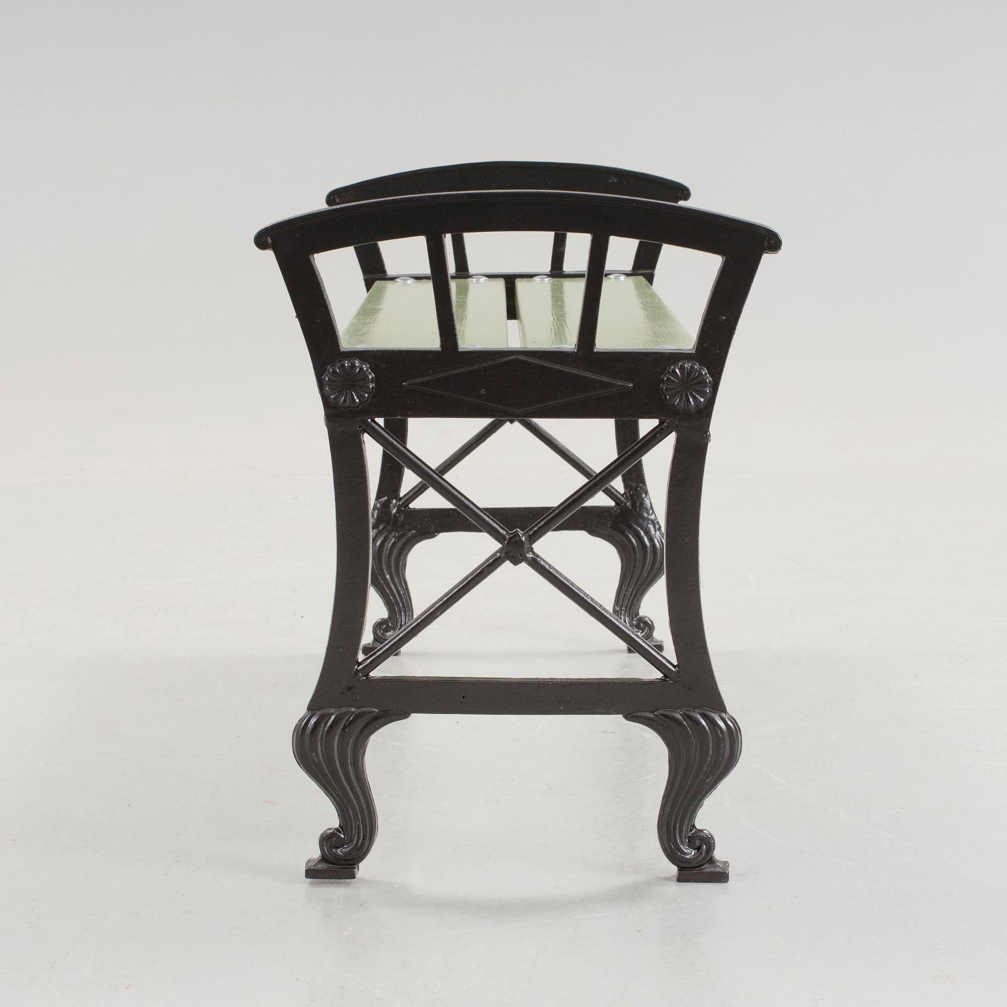 A Folke Bensow cast iron and wood park bench, Näfveqvarn, 20th Century.