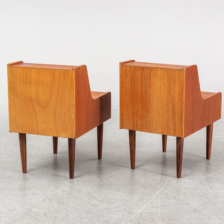 A pair of teak veneered bedside tables.