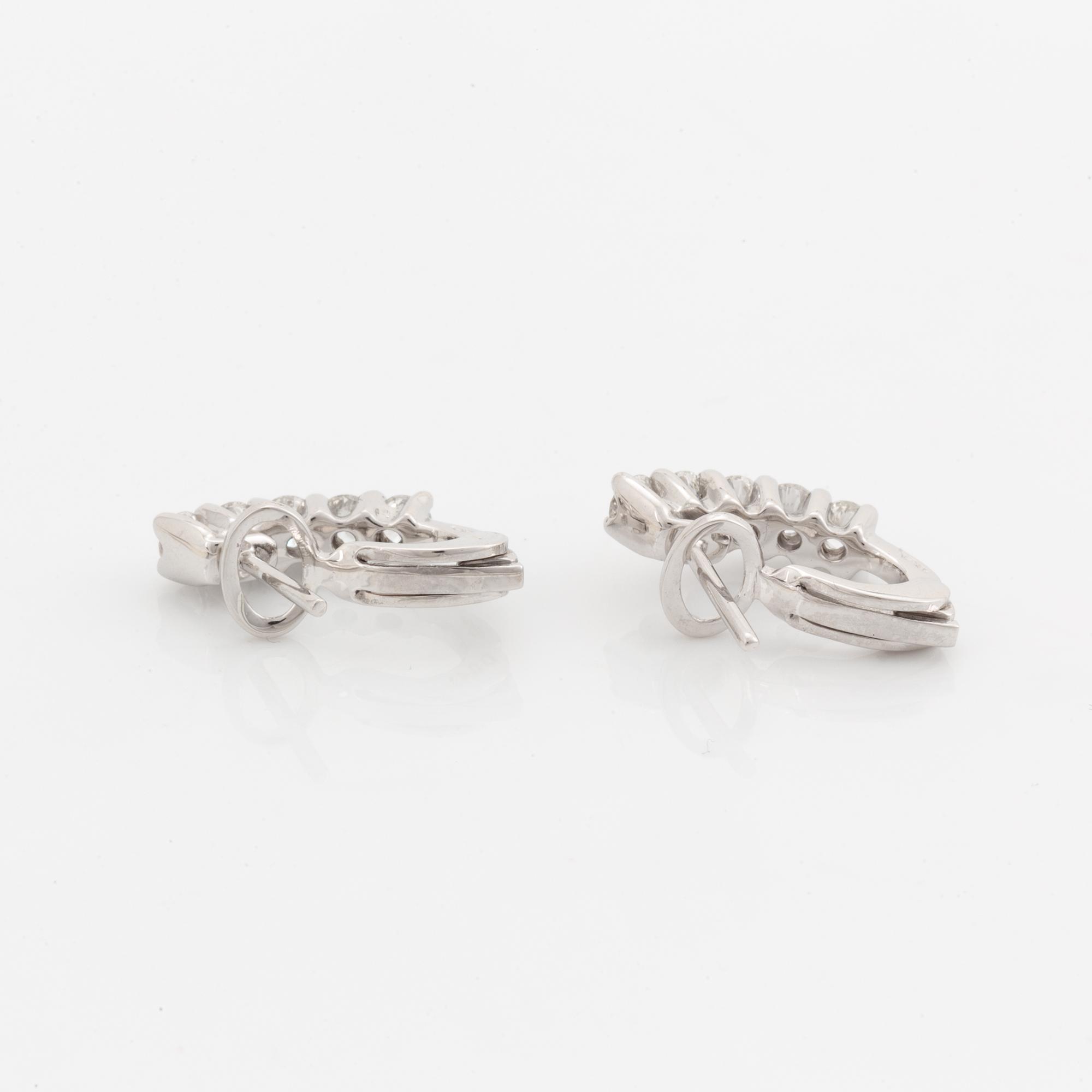 Brilliant-cut diamond earrings.