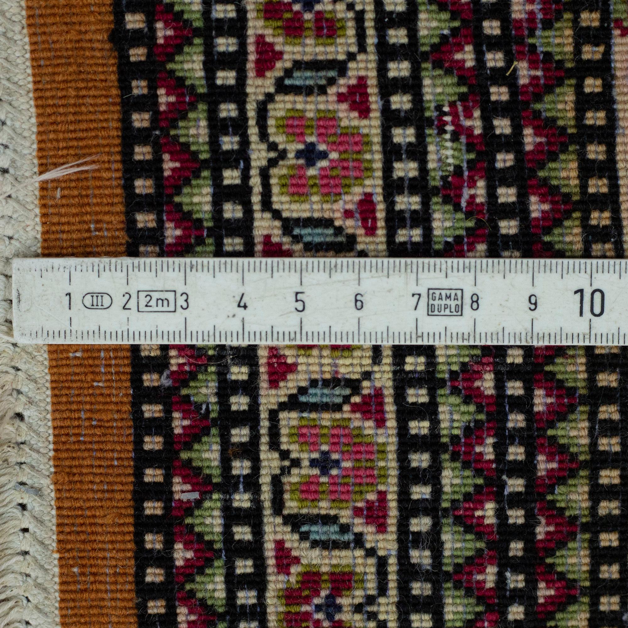 A RUG, Old Qum, ca 216 x 140 cm.