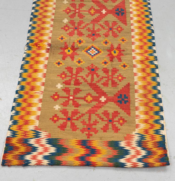 A carriage cushion, double-interlocked tapestry, ca 50 x 99,5 cm, Scania, (Sweden), first half of the 19th century.