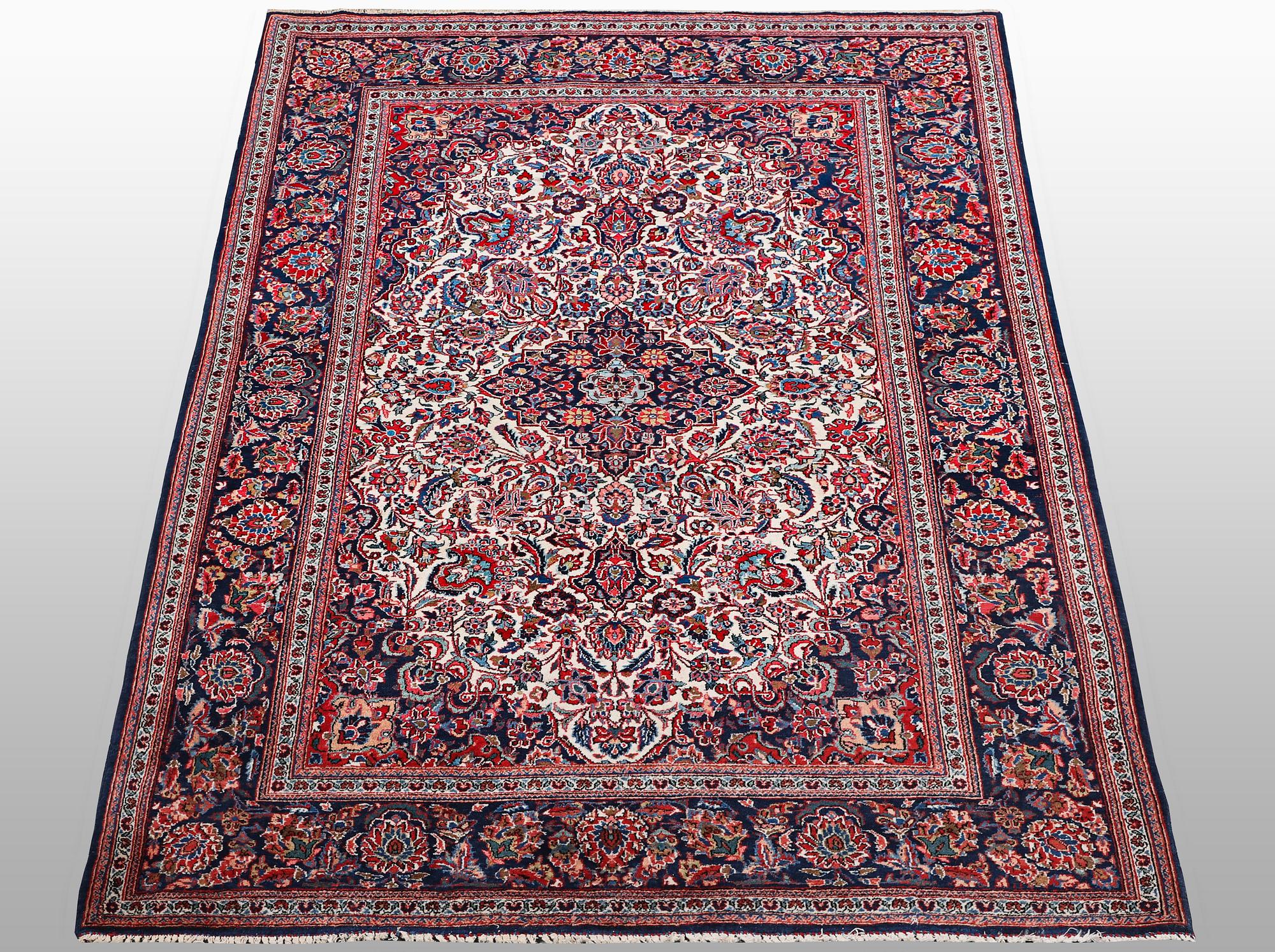 A rug, semi-antique Keshan, 217 x 134 cm.