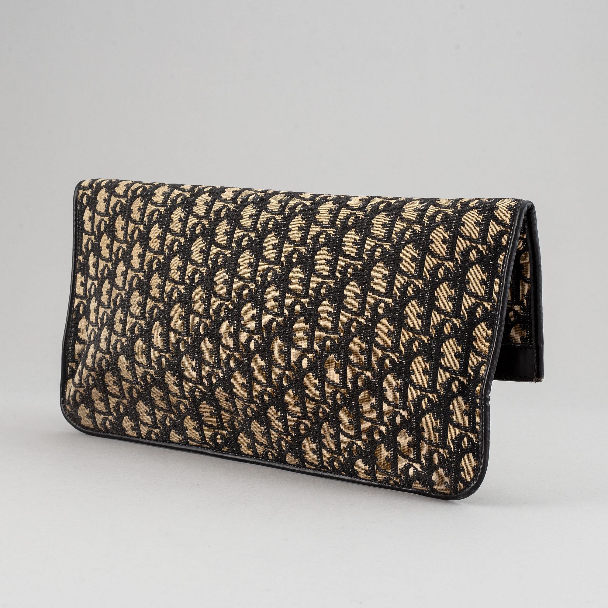 Christian Dior, a 'Oblique fold-over convertible clutch'.