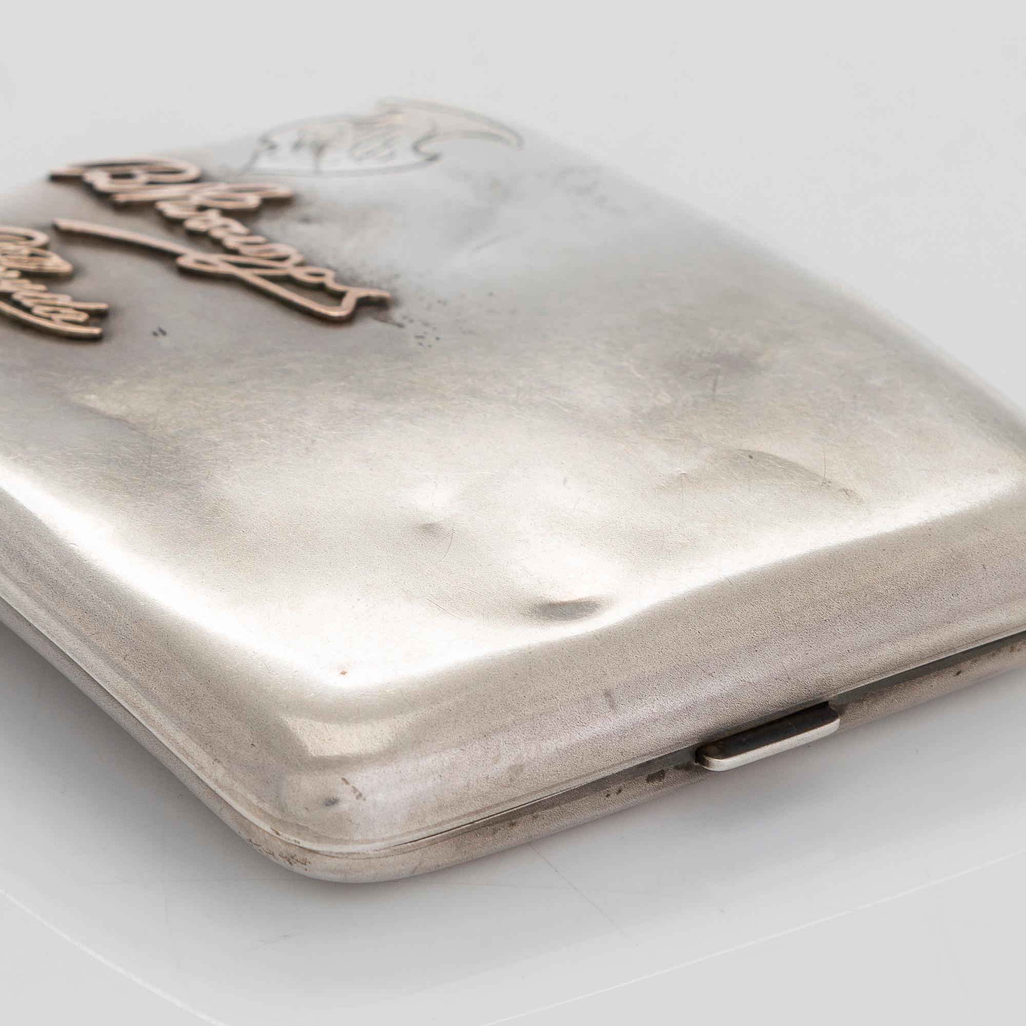Two silver cigarette cases, J. H. Werner, Berlin, 1922, and Huguenin Frères, Switzerland before 1933.