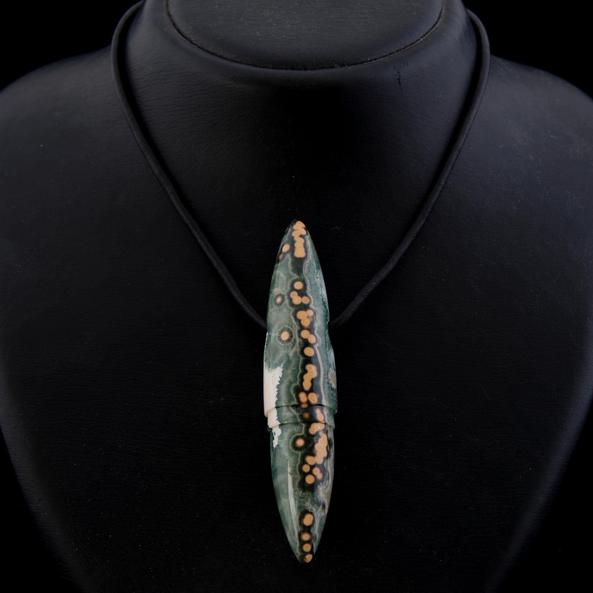 A BERND MUNSTEINER PENDANT, "Symbolon", cut jasper, leather.