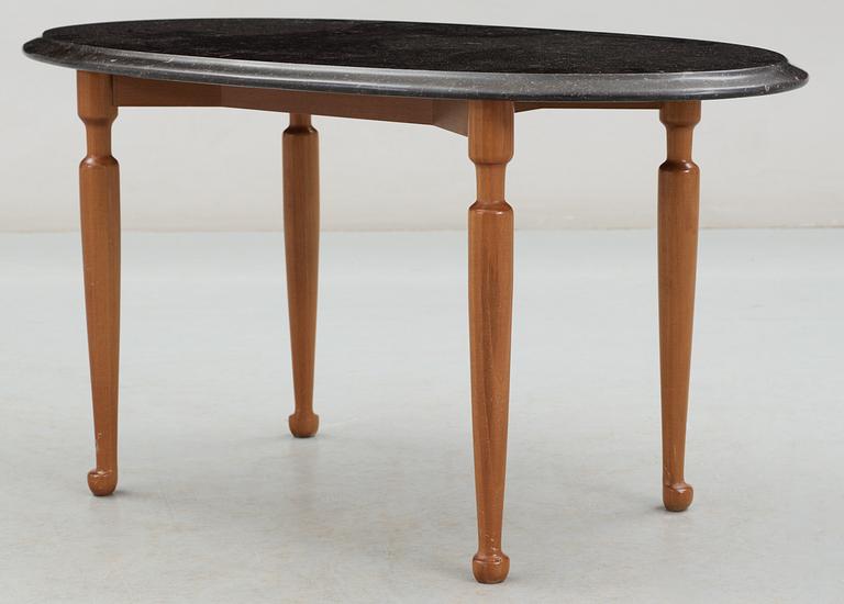 A Josef Frank black marble top and mahogany table by Svenskt Tenn.