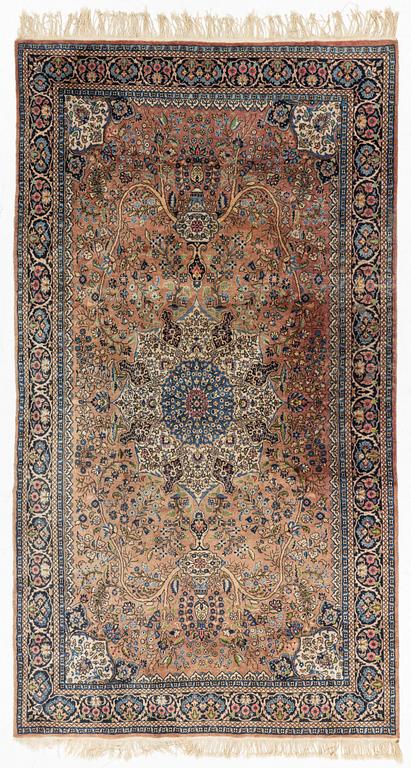 An oriental rug, circa 245 x 136 cm.