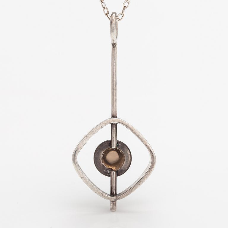 Elis Kauppi, A silver necklace with a smoaky quartz. Kupittaan kulta, Turku.