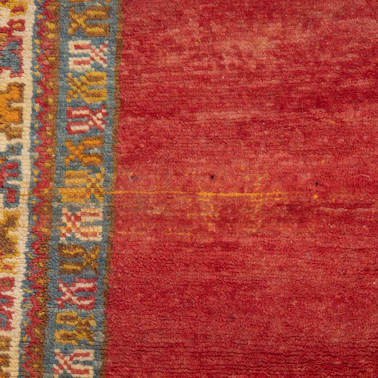 A North African carpet, c. 294 x 198 cm.