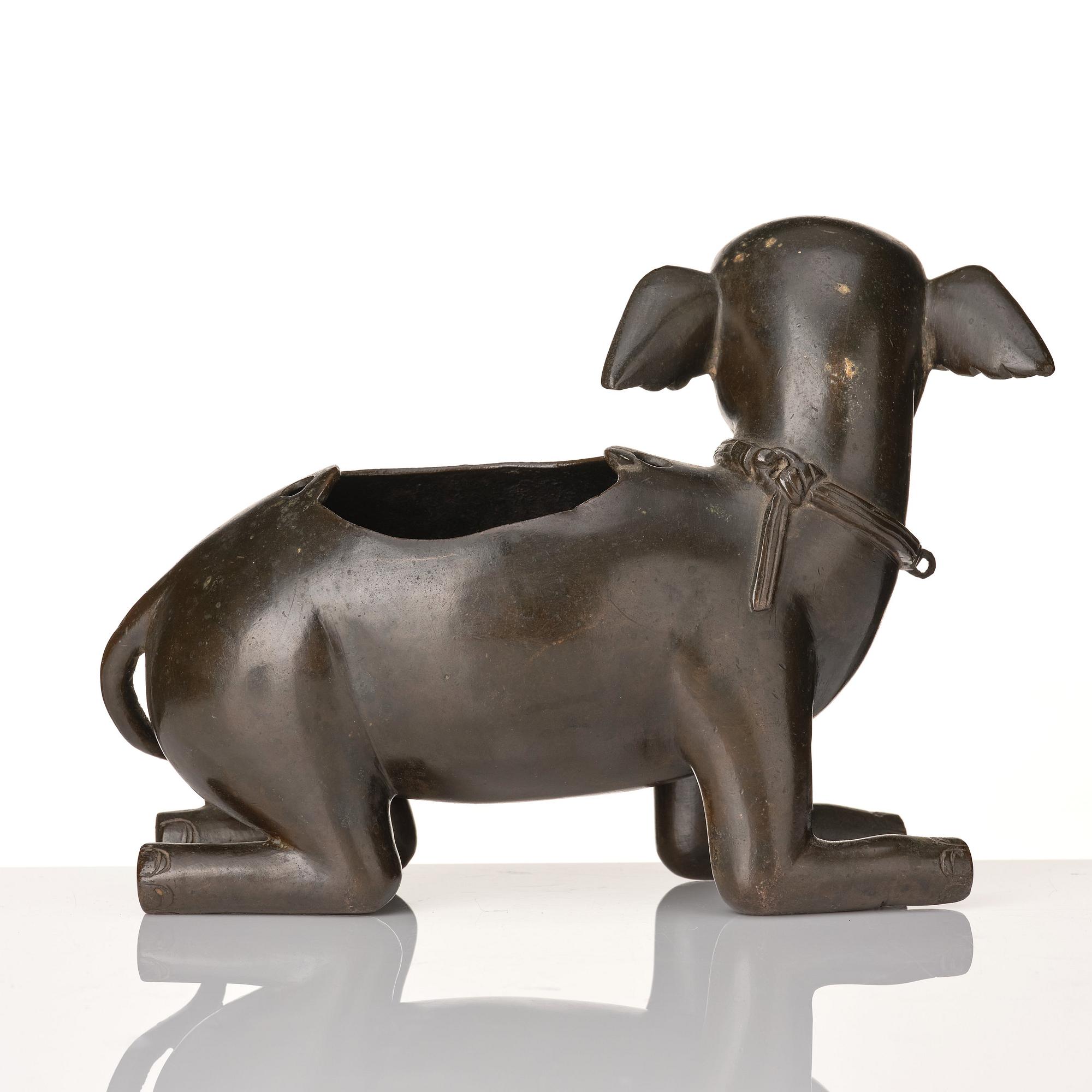 A bronze figure/censer of a reclining elephant, Qing dynasty, 19th Century.