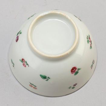 Eleven Chinese porcelian cups and saucers and two small dishes, circa 1800.