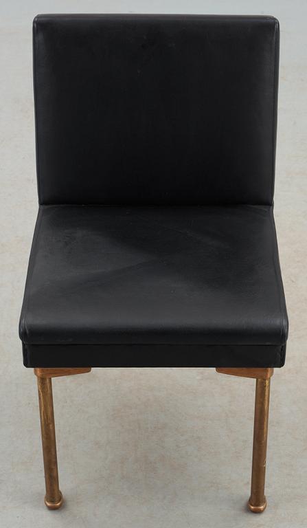An Alvar Aalto bronze and black leather chair, Artek, Finland 1954.