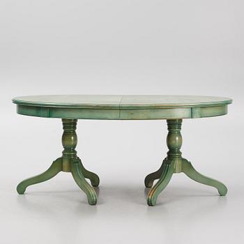 A dining table with eight chairs, Grange, France, late 20th century.