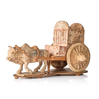 1079. A pottery model of an ox with cart, Tang dynasty (618-907).