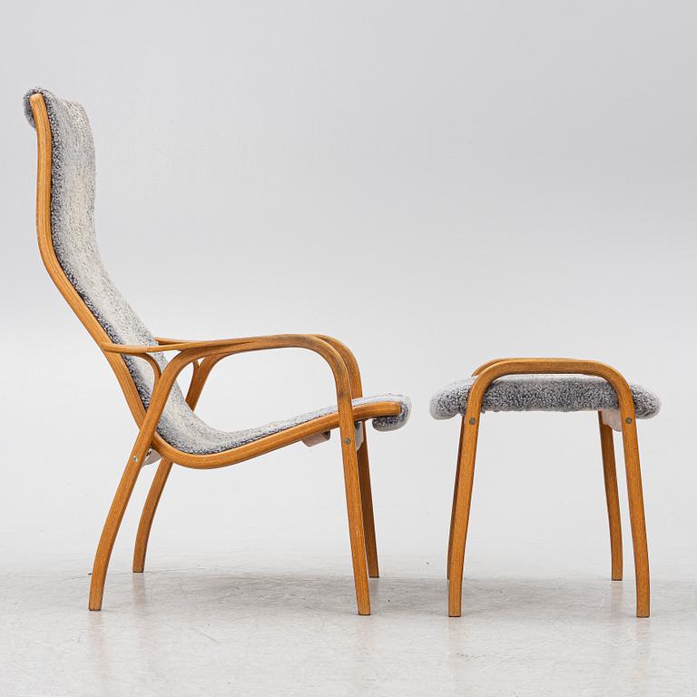 Yngve Ekström, a 'Lamino' armchair with ottoman and sidetable, Swedese, Sweden, 21st century.