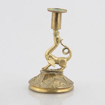 A rococo-style brass candlestick, 18th century and later.