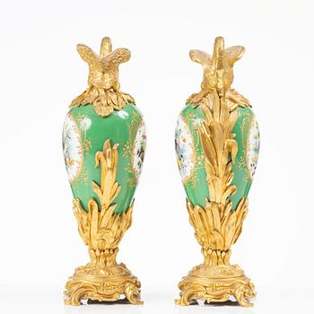 A pair of Louis XV-style gilt bronze and porcelain decorative ewers, France, later part 19th century.